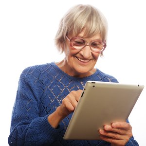 bigstock-Senior-happy-woman-using-ipad--73149421.jpg